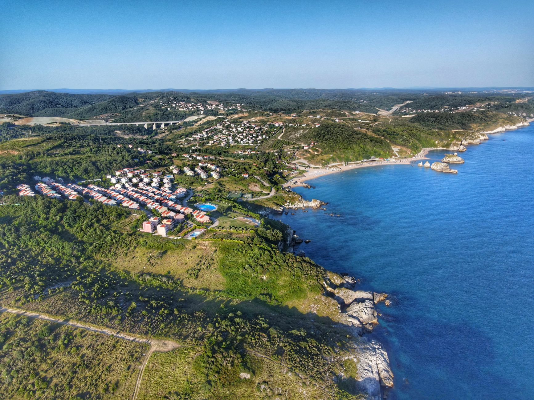 A guide to hospitals and clinics in Zekeriyaköy, Sarıyer, set against forest